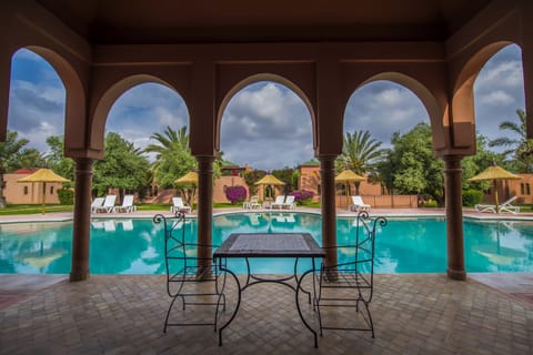 Outdoor pool, open 8 AM to 8 PM, pool umbrellas, sun loungers