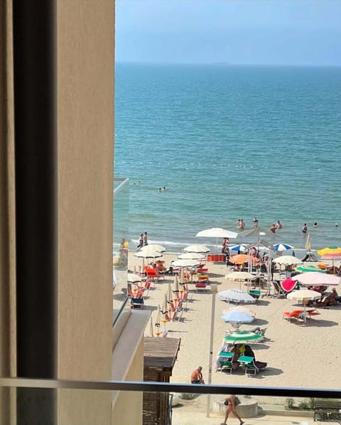 Classic Triple Room, Partial Sea View | Minibar, desk, soundproofing, free cribs/infant beds