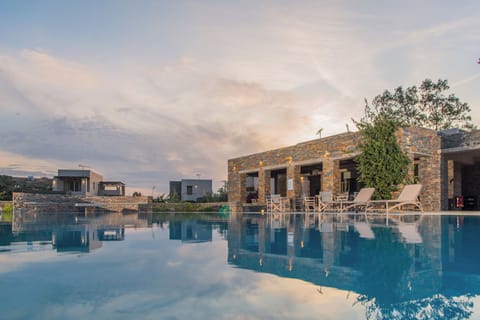 Seasonal outdoor pool, open 10:00 AM to 7:00 PM, pool umbrellas