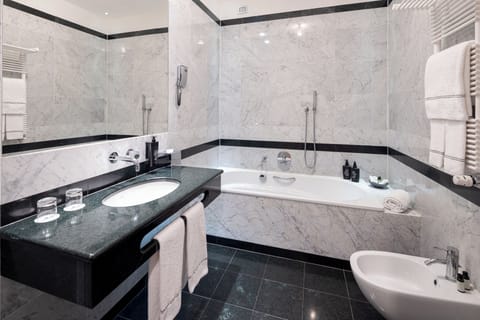 Suite, 1 Queen Bed, Balcony (View) | Bathroom | Shower, rainfall showerhead, hair dryer, bathrobes