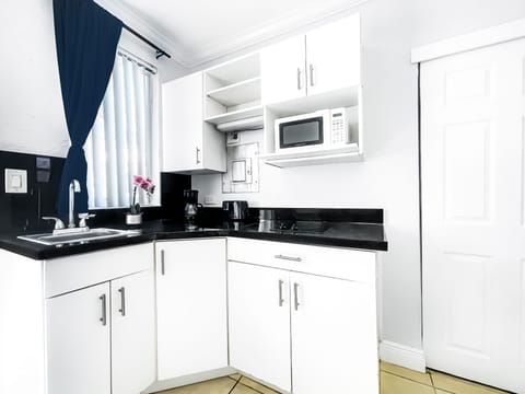 Fridge, microwave, stovetop, coffee/tea maker