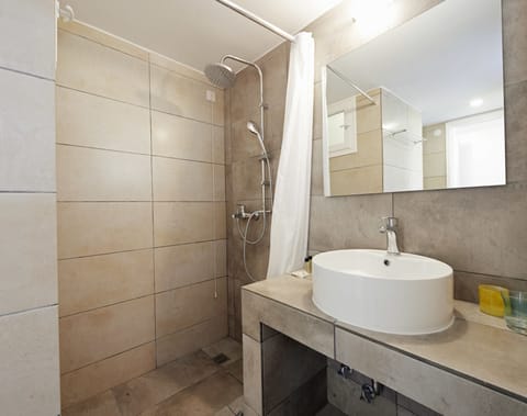 Family Suite, 2 Bedrooms (Side View) | Bathroom | Shower, free toiletries, hair dryer, towels
