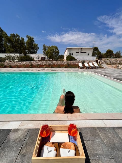 Seasonal outdoor pool, open 8:30 AM to 8:00 PM, pool umbrellas