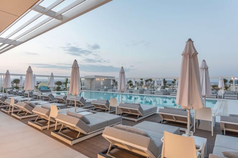 Seasonal outdoor pool, open 9 AM to 7:00 PM, free cabanas
