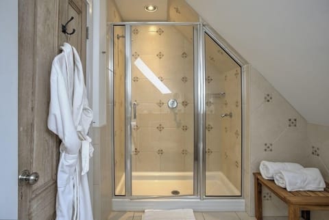 Suite, 1 King Bed | Bathroom | Shower, free toiletries, hair dryer, bathrobes