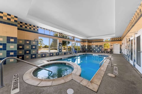 Indoor pool, open 7:00 AM to 11:00 PM, pool umbrellas, sun loungers