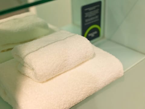 Twin Room | Bathroom amenities | Shower, eco-friendly toiletries, hair dryer, towels