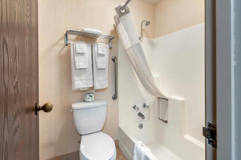 Desk, laptop workspace, blackout drapes, iron/ironing board