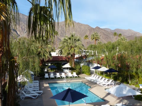 Outdoor pool, open 8 AM to midnight, pool umbrellas