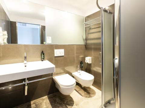 Shower, rainfall showerhead, hair dryer, towels