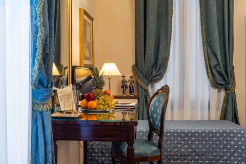 Triple Room | Minibar, in-room safe, desk, soundproofing