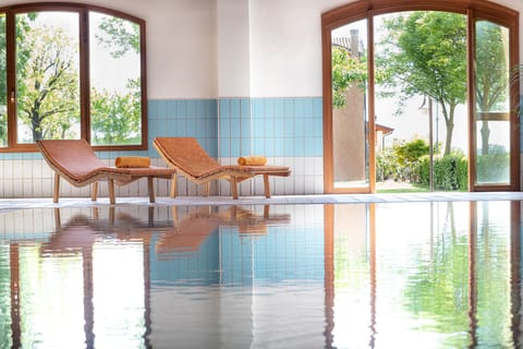 Indoor pool, seasonal outdoor pool, pool umbrellas, sun loungers
