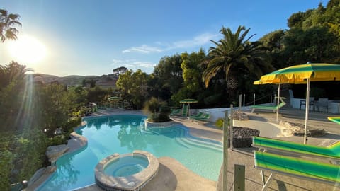 Seasonal outdoor pool, open 9:00 AM to 8:30 PM, pool umbrellas