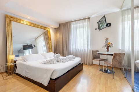 Suite | Premium bedding, down comforters, memory foam beds, minibar