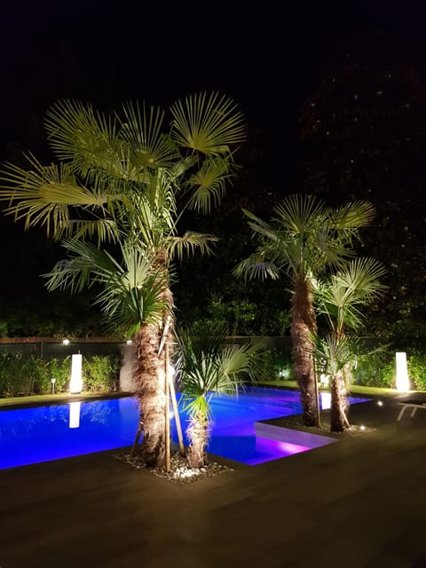 Seasonal outdoor pool, an infinity pool, pool umbrellas, sun loungers