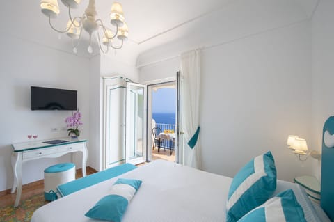 Standard Triple Room, Terrace, Sea View | Down comforters, in-room safe, desk, laptop workspace