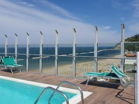 Seasonal outdoor pool, open 8:30 AM to 7:00 PM, sun loungers