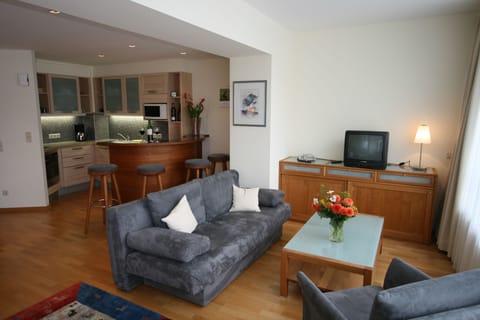 Standard Apartment (Typ A) | Living area | 42-inch LED TV with cable channels, TV, heated floors