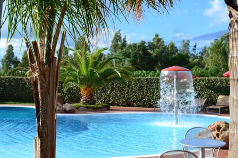 Seasonal outdoor pool, pool umbrellas, sun loungers
