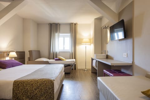 Economy Triple Room, Shared Bathroom | Minibar, in-room safe, desk, free WiFi