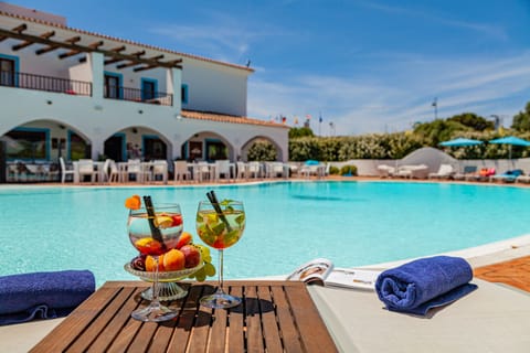 Outdoor pool, open 10:00 AM to 7:00 PM, pool umbrellas, sun loungers