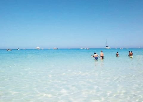 Private beach, white sand, sun loungers, beach umbrellas