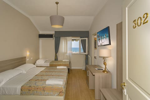 Triple Room, Sea View | Hypo-allergenic bedding, minibar, in-room safe, free WiFi