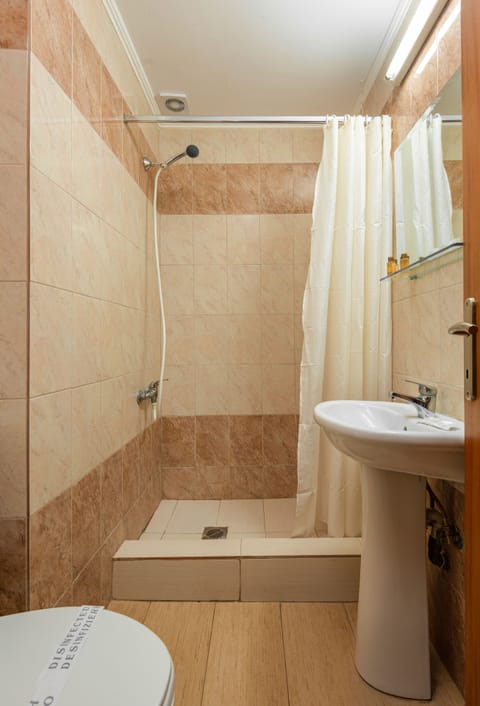 Standard Double Room | Bathroom | Shower, free toiletries, hair dryer, slippers