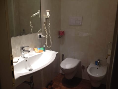 Hair dryer, slippers, bidet, towels