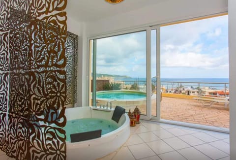 Outdoor pool, an infinity pool, open open 24 hours, pool umbrellas