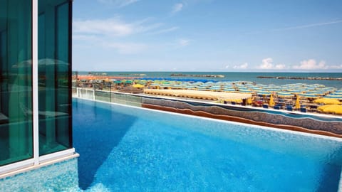 Outdoor pool, open 9:00 AM to 10:00 PM, pool umbrellas, sun loungers