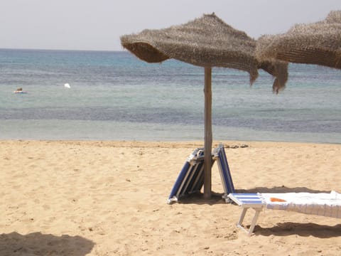 Private beach nearby, white sand, sun loungers, beach umbrellas