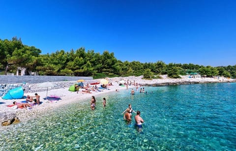 Beach nearby, beach shuttle, beach towels, 3 beach bars