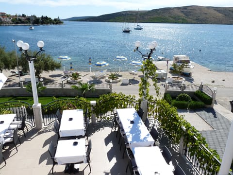 On the beach, sun loungers, beach umbrellas, beach towels