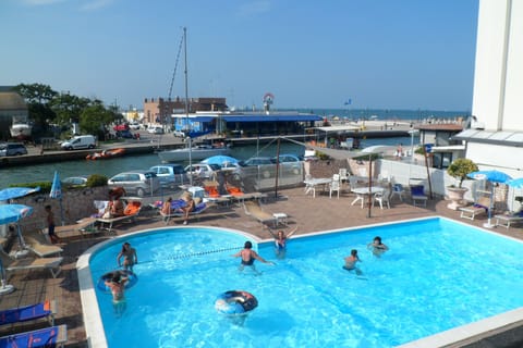 Outdoor pool, open 9:00 AM to 7:00 PM, pool umbrellas, sun loungers