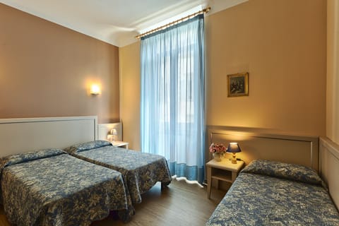 Triple Room, Private Bathroom | In-room safe, desk, iron/ironing board, free WiFi