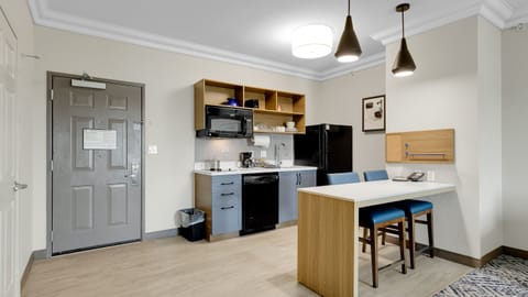 Suite, 1 Bedroom | Private kitchen | Full-size fridge, microwave, stovetop, dishwasher