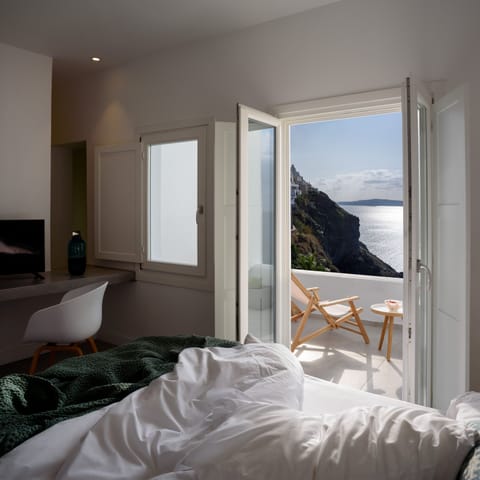 Suite, Balcony (Caldera View) | Premium bedding, minibar, in-room safe, individually decorated