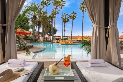 Outdoor pool, open 7:00 AM to 10:00 PM, cabanas (surcharge)