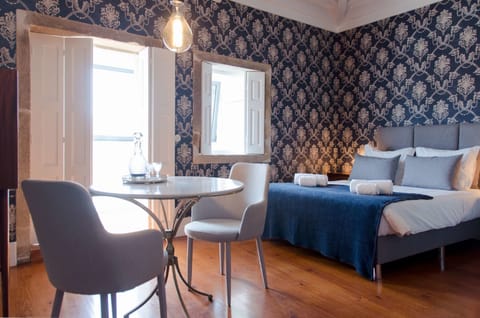 Deluxe Studio (Second Floor) | Living area | 32-inch flat-screen TV with cable channels, TV