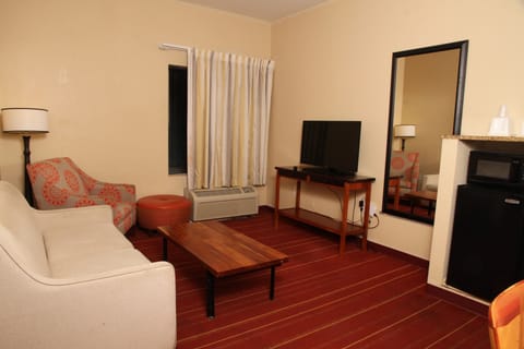 Suite, 1 Bedroom, Non Smoking (1 King Bed) | Desk, laptop workspace, blackout drapes, iron/ironing board