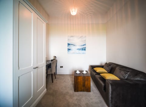 Deluxe Double Room, 1 Double Bed with Sofa bed, Private Bathroom, Sea View | Living area | 32-inch LED TV with digital channels, TV