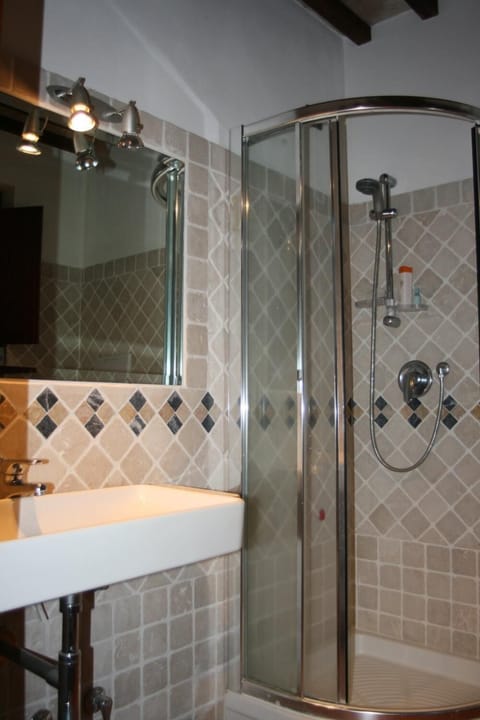 Shower, free toiletries, hair dryer, slippers