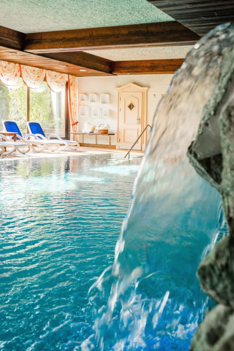 Indoor pool, pool umbrellas, sun loungers