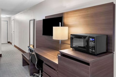 Hypo-allergenic bedding, desk, laptop workspace, blackout drapes