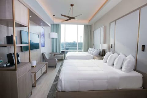 Desk, laptop workspace, iron/ironing board, free cribs/infant beds