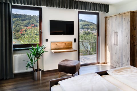 Deluxe Double Room, Balcony, River View | Television