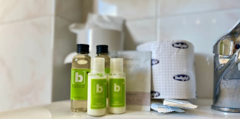 Shower, free toiletries, hair dryer, slippers