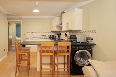 Family Apartment, 1 Bedroom | Private kitchen | Coffee/tea maker