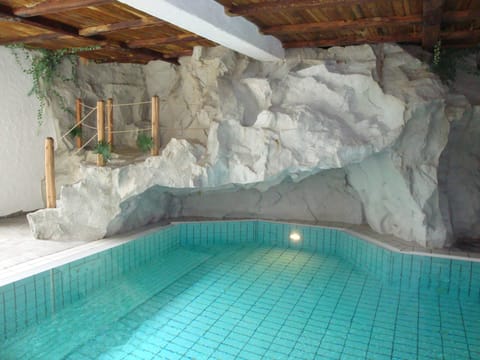 Indoor pool, seasonal outdoor pool, pool umbrellas, sun loungers